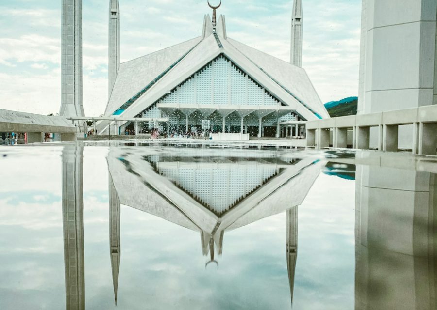 Architectural detail of Faisal Mosque reflected in water
